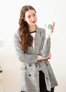 Woman holding Starbucks