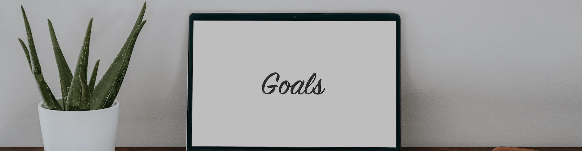 Laptop on a wooden table